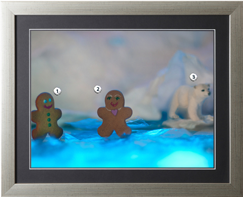Gingerbread men chat while a polar bear looks on